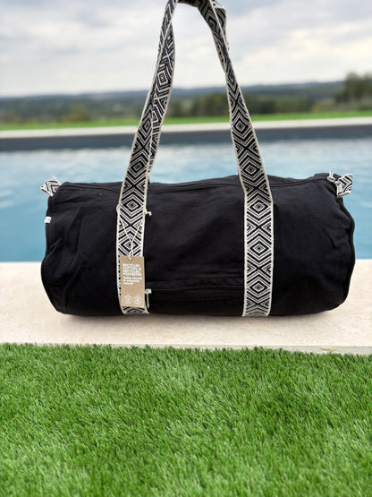 Sac polochon en coton tissu noir avec poignées motifs géométriques en noir et blanc