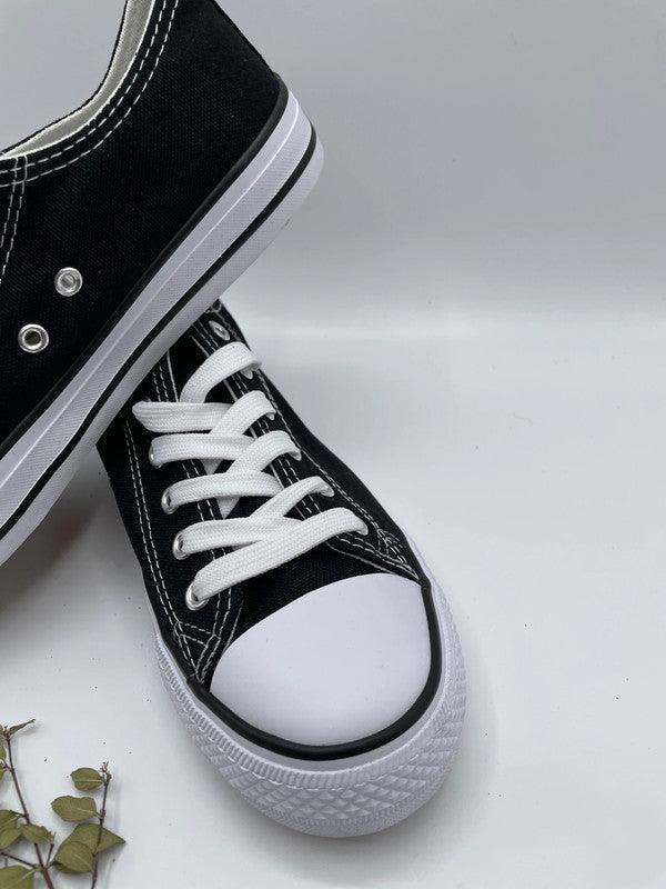 Converse basse blanche et noir on sale