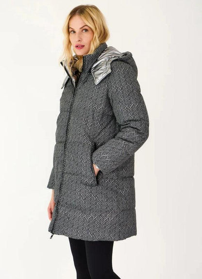 Woman wearing a grey reversible quilted waterproof Escandelle coat from Le Petit Placard