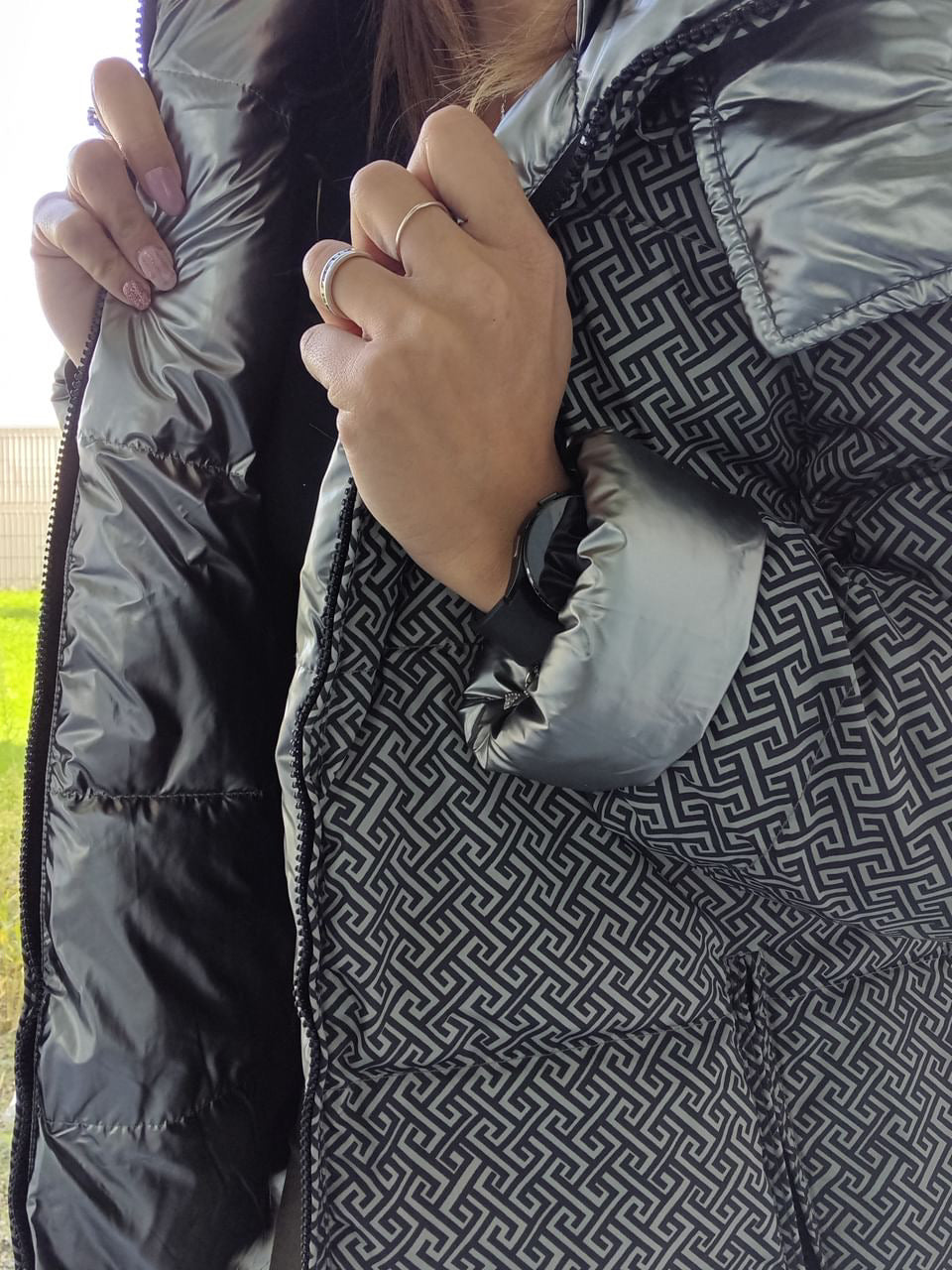 Close-up of reversible silver quilted raincoat with geometric pattern from Le Petit Placard