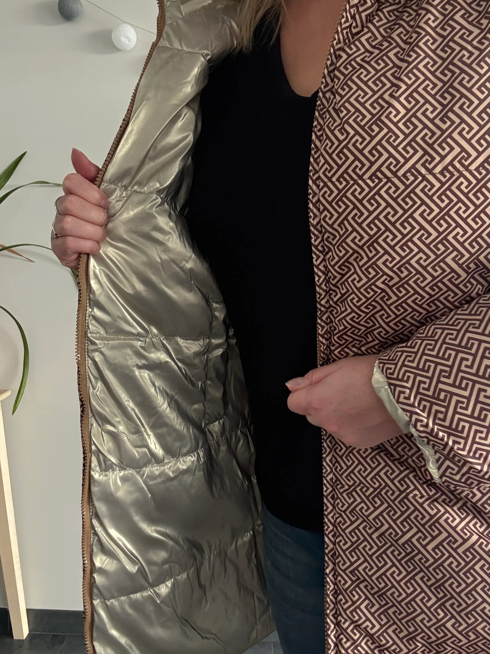 Woman modeling Laura Jo geometric print raincoat with shiny gold lining, Le Petit Placard