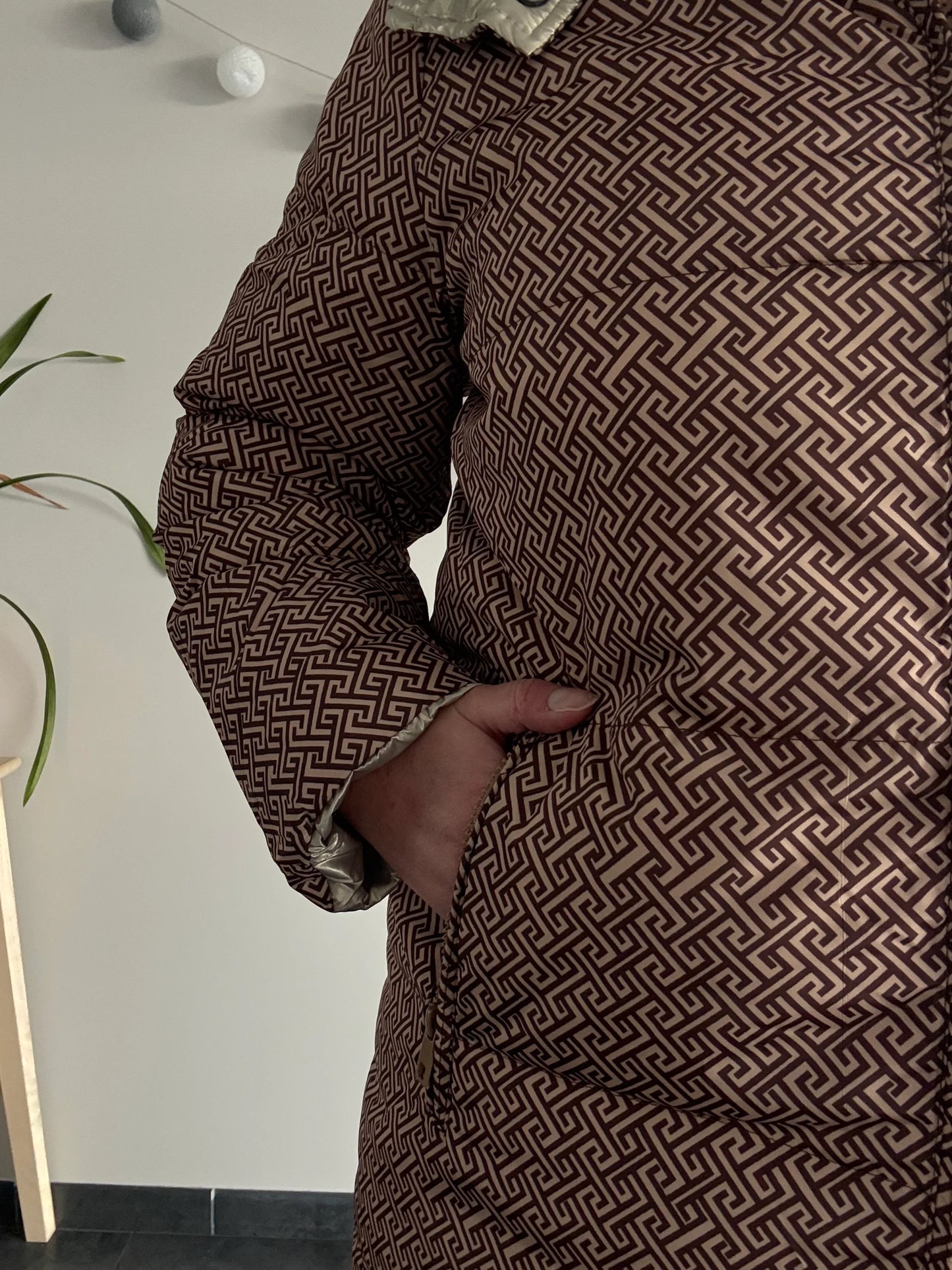 Close-up of Laura Jo patterned brown waterproof jacket at Le Petit Placard