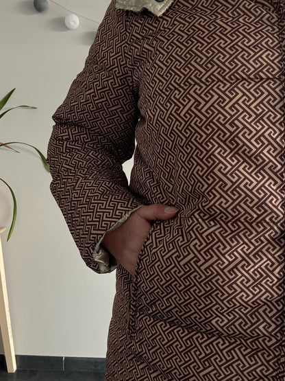 Close-up of Laura Jo patterned brown waterproof jacket at Le Petit Placard