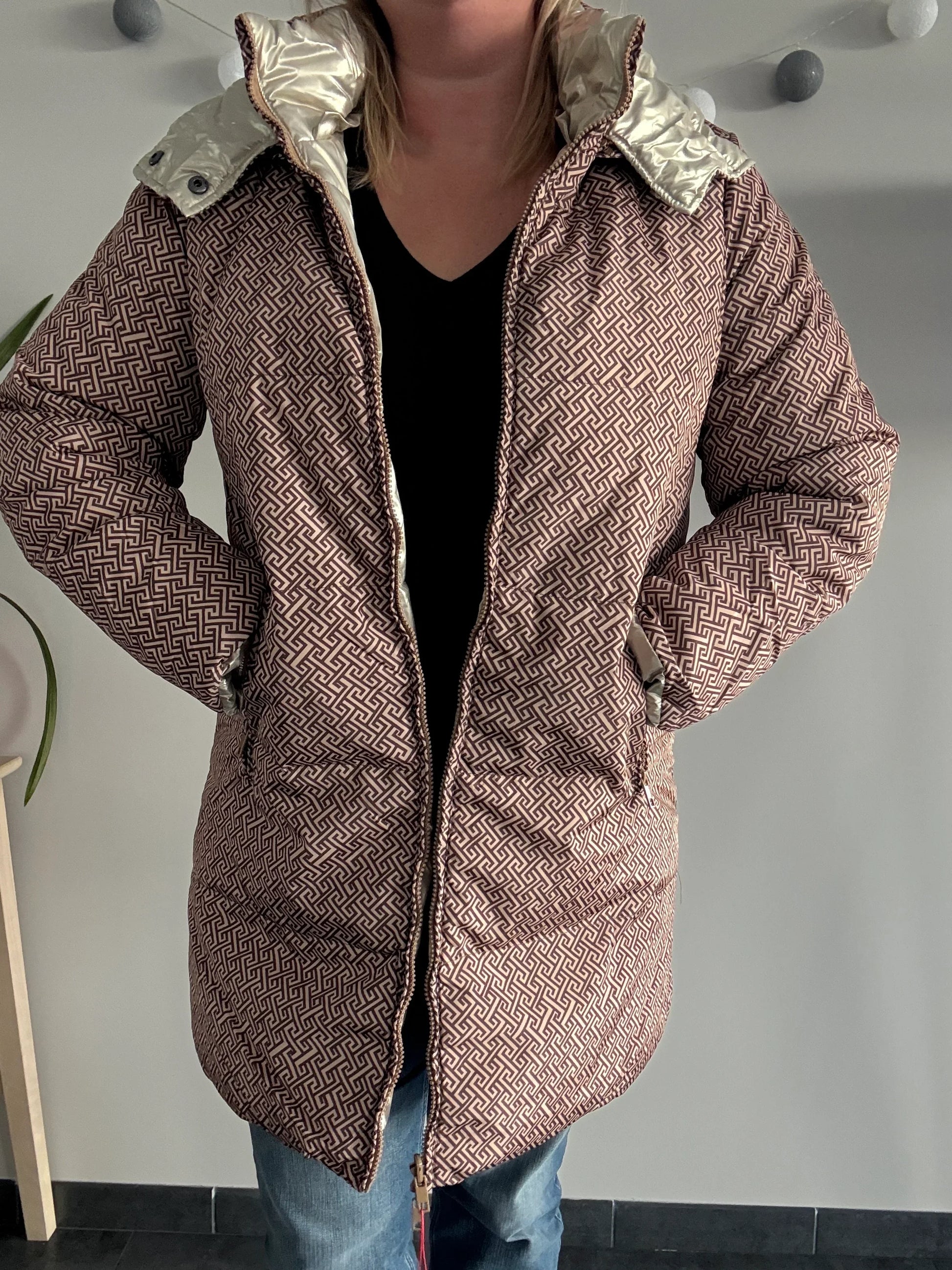 Woman wearing Laura Jo patterned waterproof coat from Le Petit Placard
