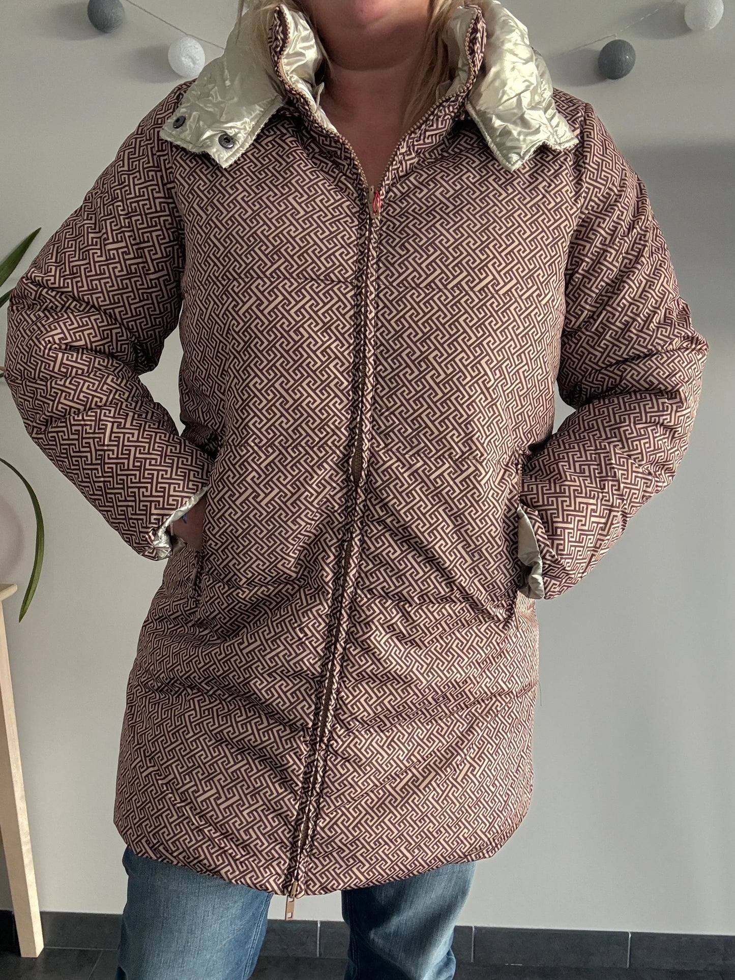 Woman wearing Laura Jo geometric patterned raincoat from Le Petit Placard