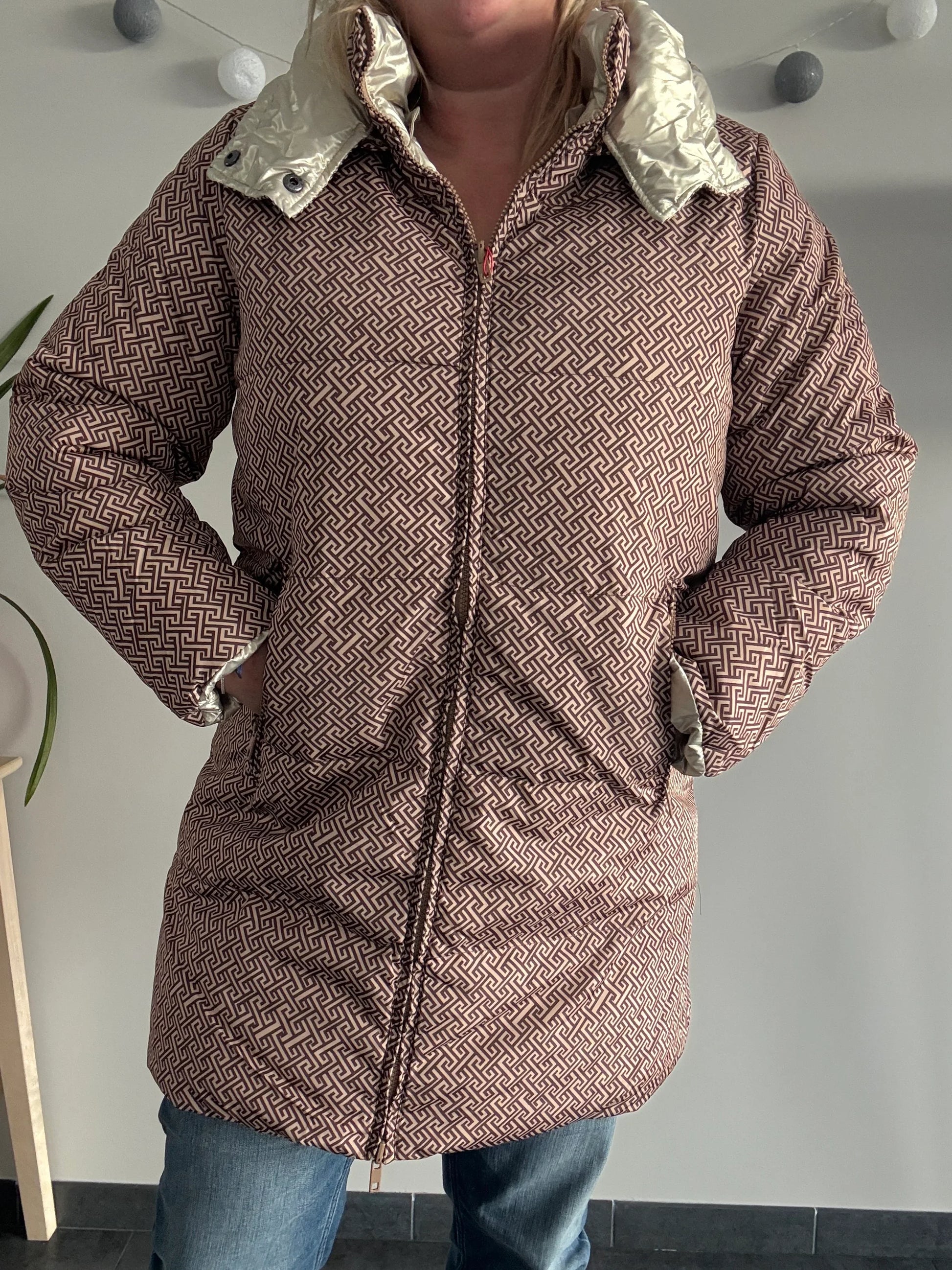 Woman wearing Laura Jo geometric patterned raincoat from Le Petit Placard