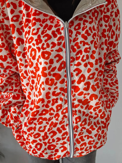 Parka imperméable courte réversible léopard orange et doré femme Escandelle – Capuche, coupe tendance et style 2-en-1 Escandelle