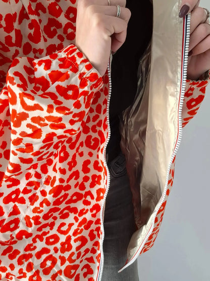 Parka imperméable courte réversible léopard orange et doré femme Escandelle – Capuche, coupe tendance et style 2-en-1 Escandelle