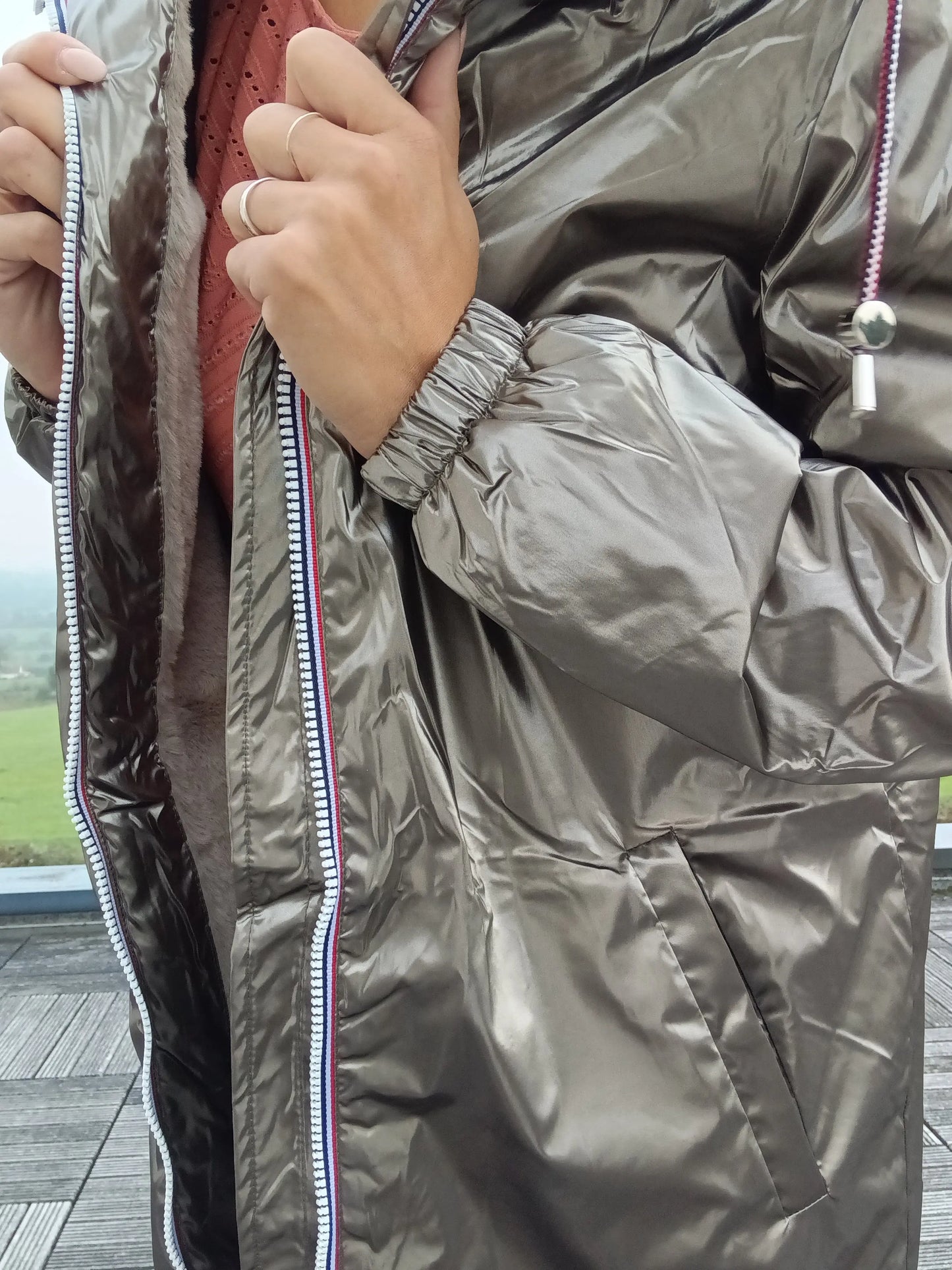 Shiny bronze Laura Jo raincoat with striped zipper, worn outdoors, Le Petit Placard fashion