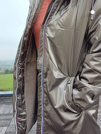 Shiny bronze Laura Jo waterproof jacket with zip detail, showcased outdoors