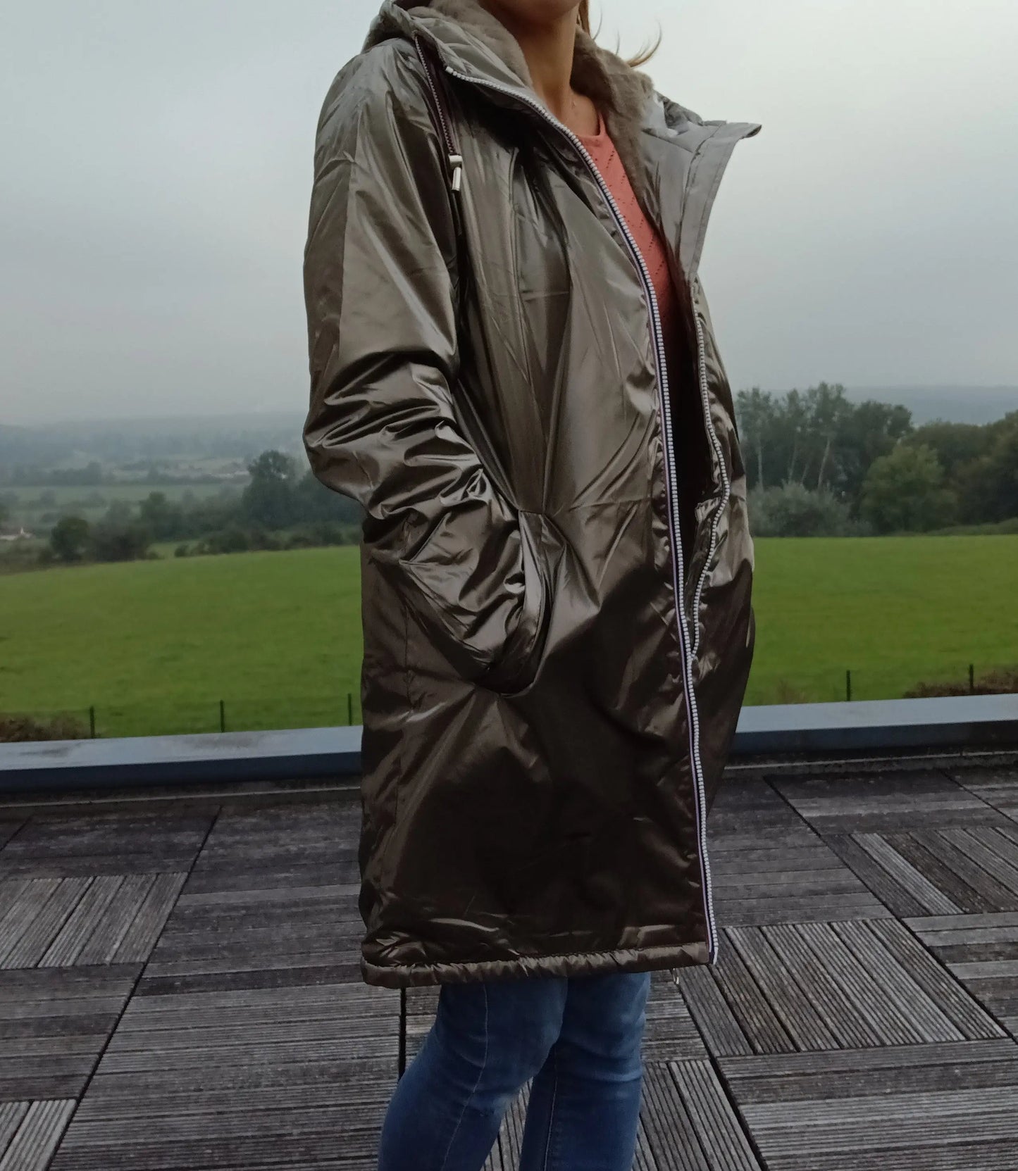 Woman wearing bronze Laura Jo raincoat outdoors, Le Petit Placard trendy waterproof jacket