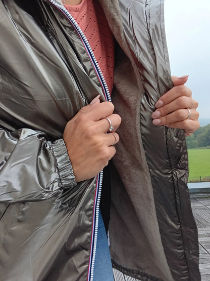 Close-up of woman wearing shiny bronze Laura Jo raincoat with fleece lining from Le Petit Placard
