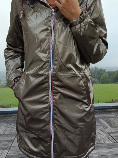 Shiny bronze Laura Jo raincoat with striped zipper, outdoor setting, Le Petit Placard