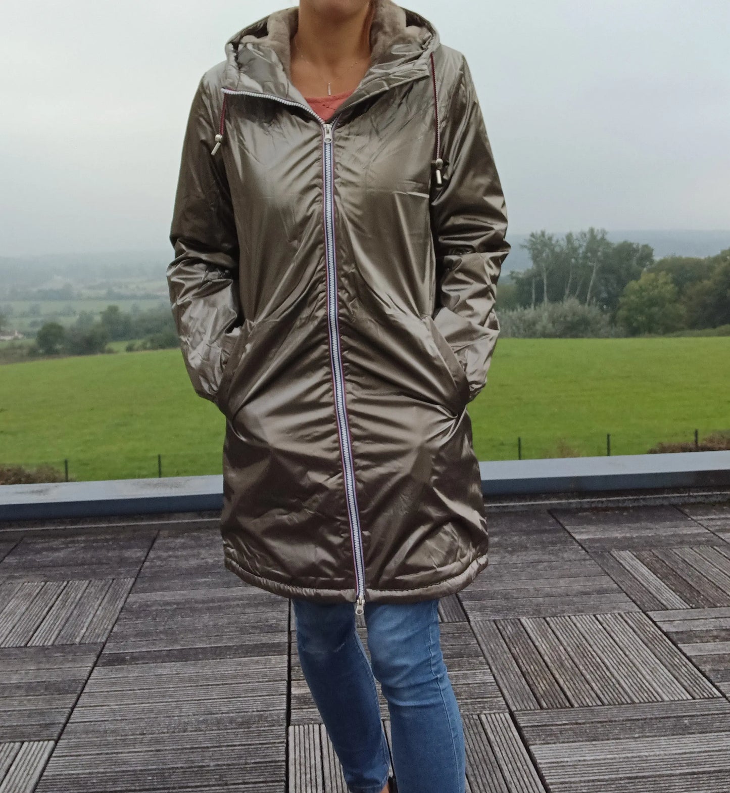 Woman wearing metallic bronze Laura Jo raincoat outdoors, Le Petit Placard fashion