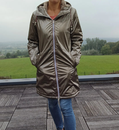 Woman wearing metallic bronze Laura Jo raincoat outdoors, Le Petit Placard fashion