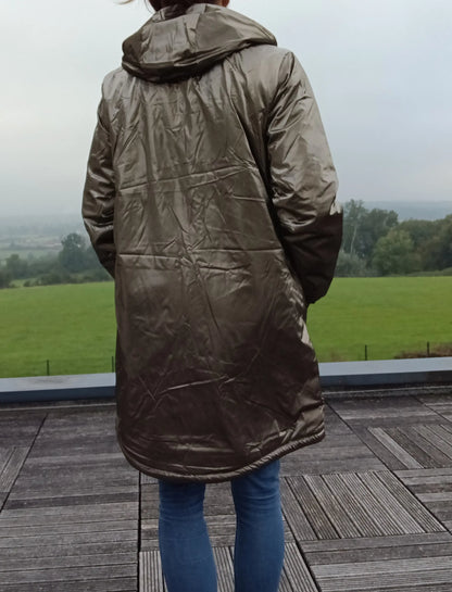 Woman wearing metallic bronze raincoat outdoor, Le Petit Placard fashion accessory
