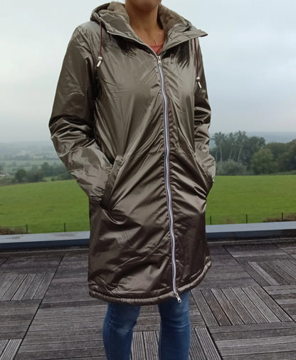 Woman wearing a bronze Laura Jo raincoat outdoors, stylish waterproof jacket Le Petit Placard