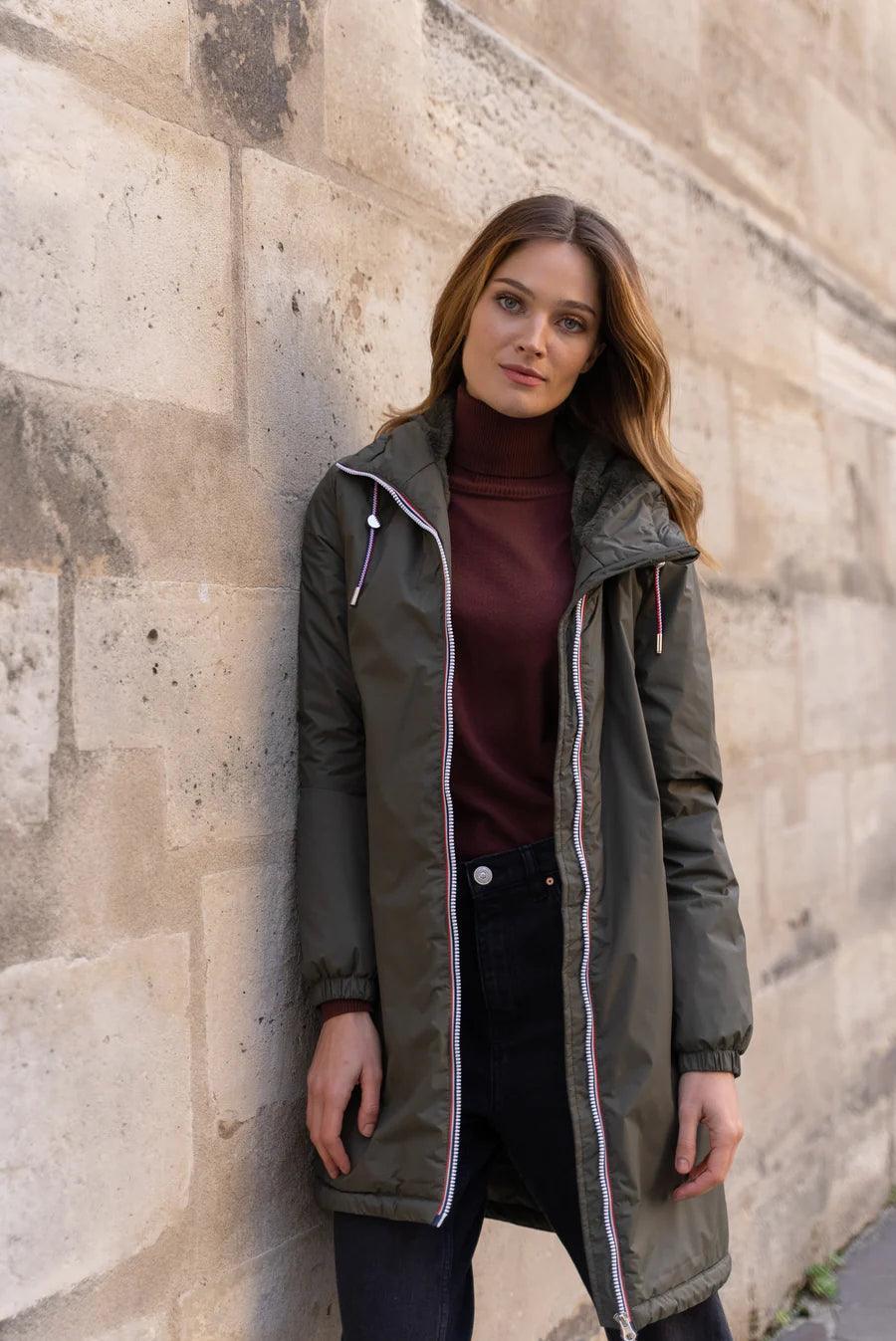 Woman wearing Laura Jo khaki long waterproof faux fur coat with tricolor drawstring, Le Petit Placard