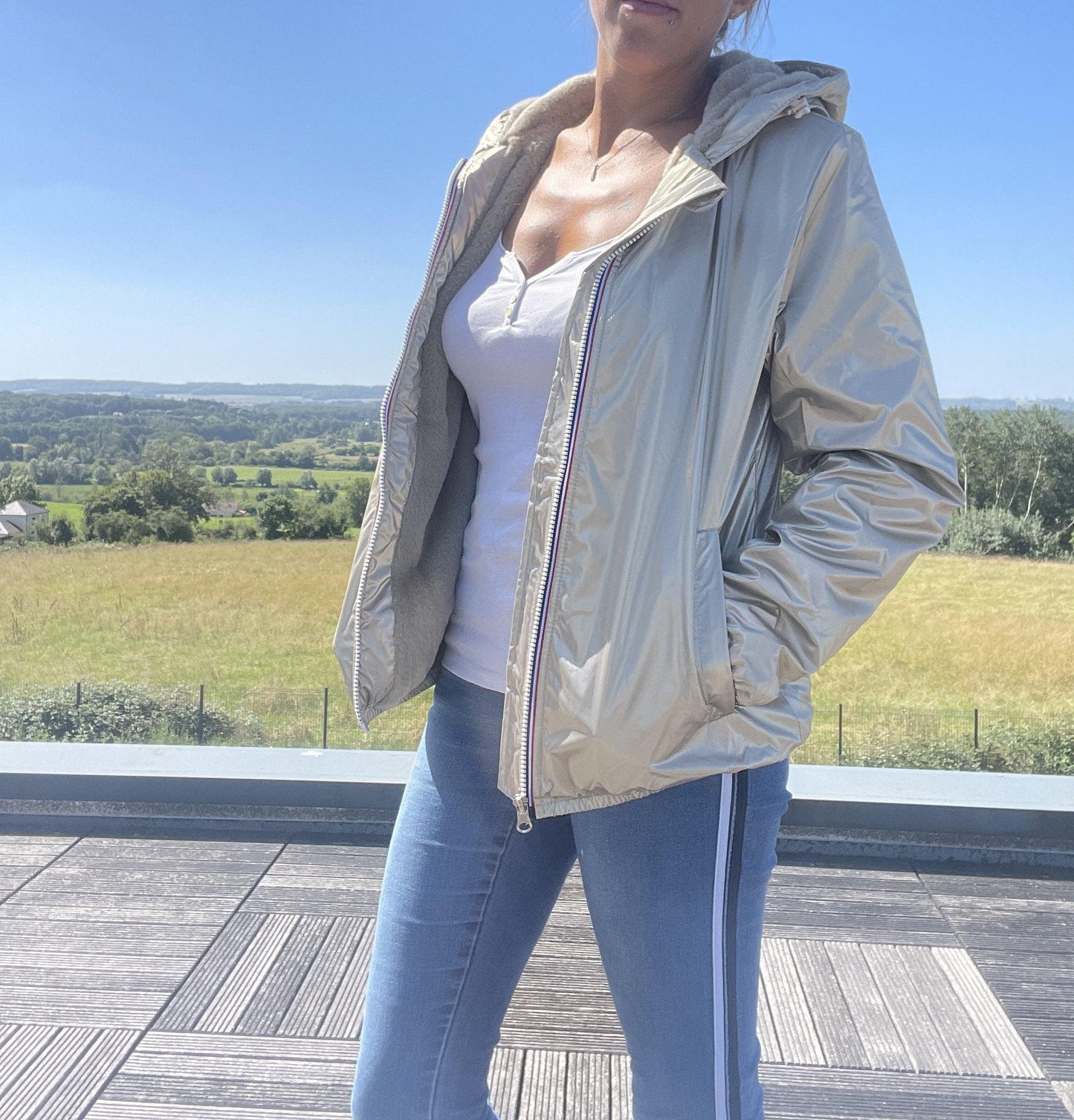 Woman wearing Laura Jo short waterproof fur-lined jacket outdoors, Le Petit Placard