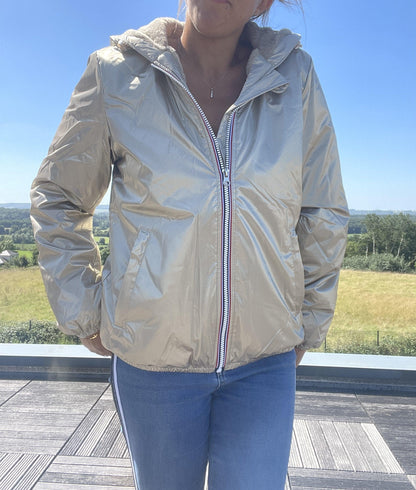 Woman wearing short gold Laura Jo waterproof jacket outdoors, Le Petit Placard fashion