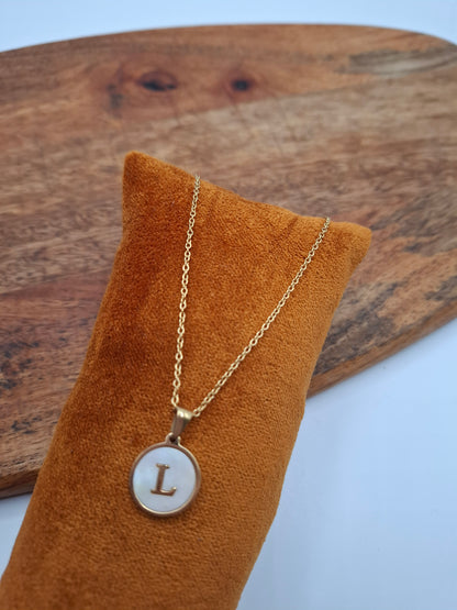 Gold initial L pendant necklace on velvet display, Le Petit Placard trendy accessory