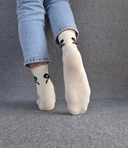 Paire de chaussettes beige en coton à motif noeud Le Petit Placard