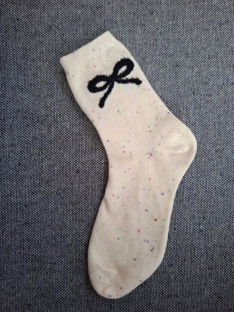 Paire de chaussettes beige en coton à motif noeud Le Petit Placard