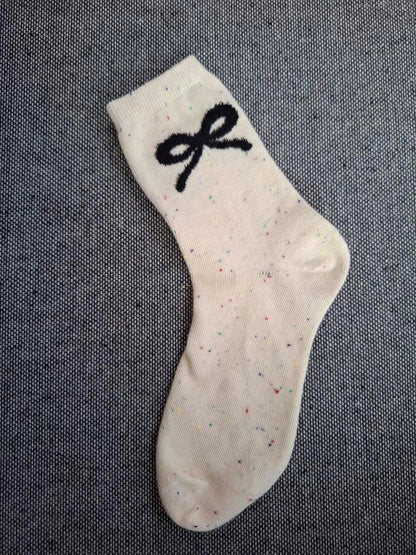 Paire de chaussettes beige en coton à motif noeud Le Petit Placard