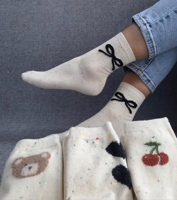 Paire de chaussettes beige en coton à motif noeud Le Petit Placard
