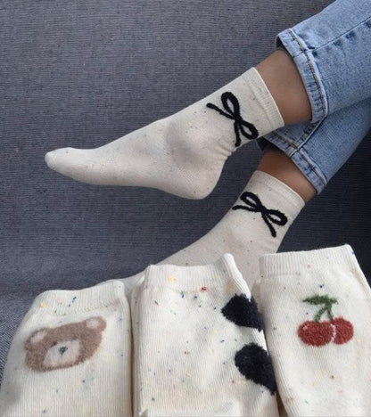 Paire de chaussettes beige en coton à motif noeud Le Petit Placard