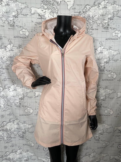 Laura Jo nude pink long raincoat on mannequin, Le Petit Placard, world map backdrop
