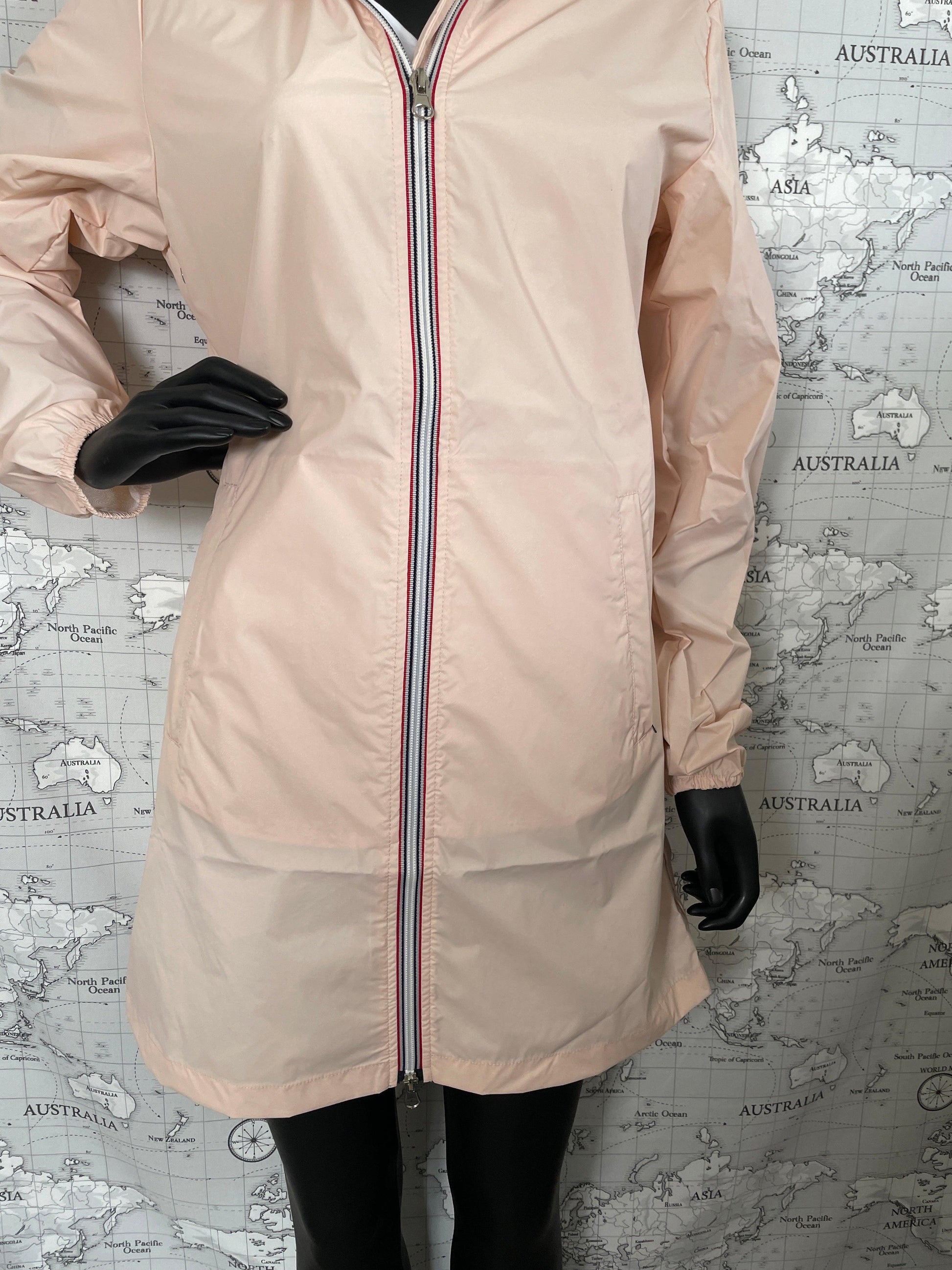 Laura Jo pink raincoat long style on mannequin, Le Petit Placard collection, front zipper