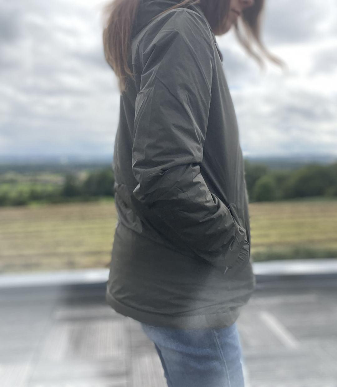 Woman wearing Laura Jo hooded raincoat outdoors, casual style, Le Petit Placard fashion