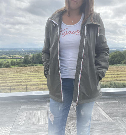 Woman wearing Laura Jo waterproof jacket and jeans outdoors, Le Petit Placard fashion