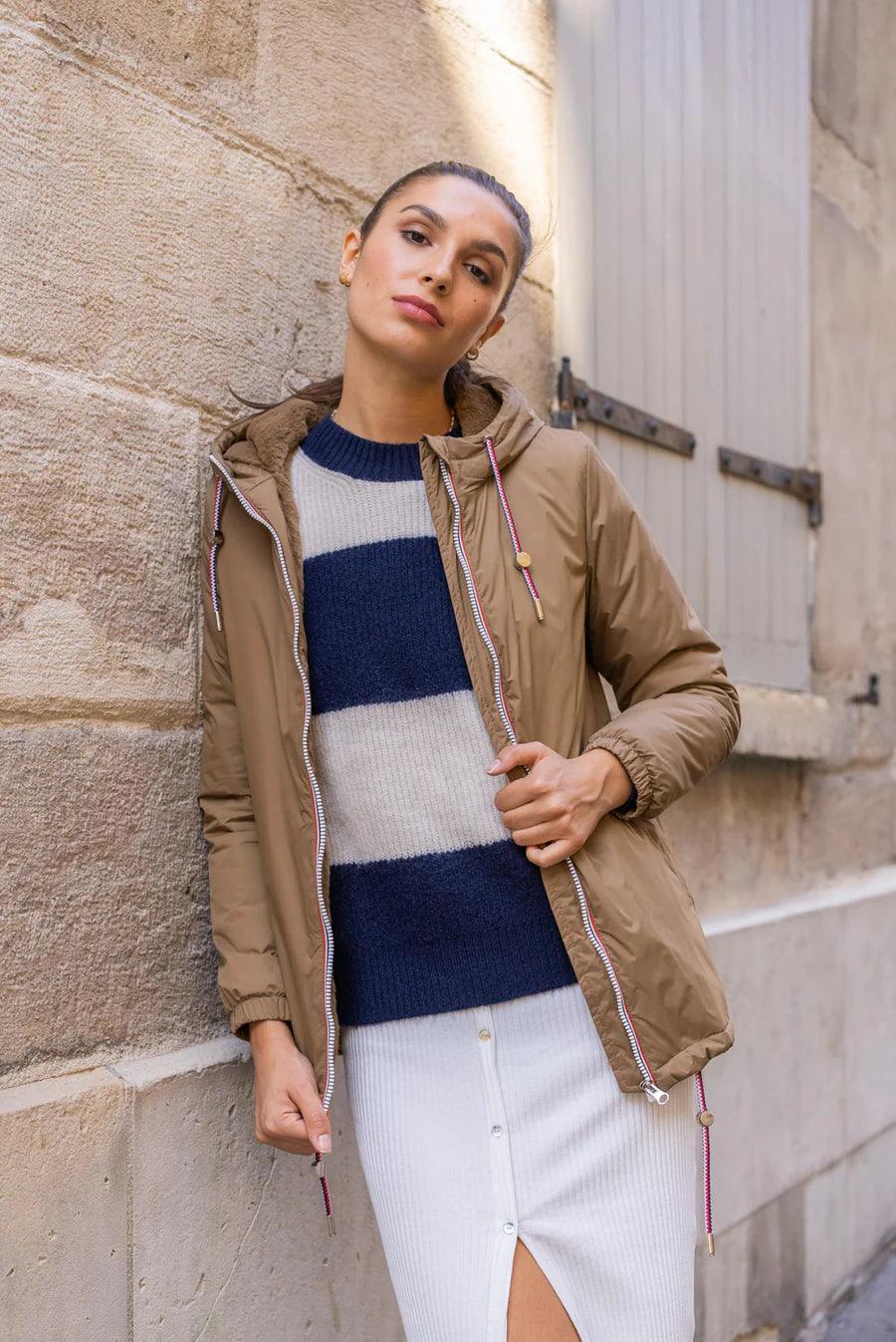 Woman wearing camel Laura Jo raincoat with tricolor drawstrings, Le Petit Placard