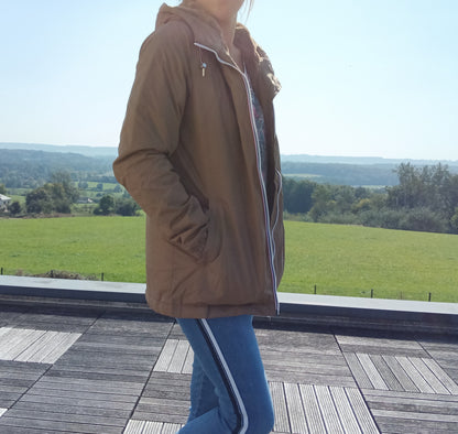Woman in camel Laura Jo raincoat and jeans outdoors, Le Petit Placard fashion style