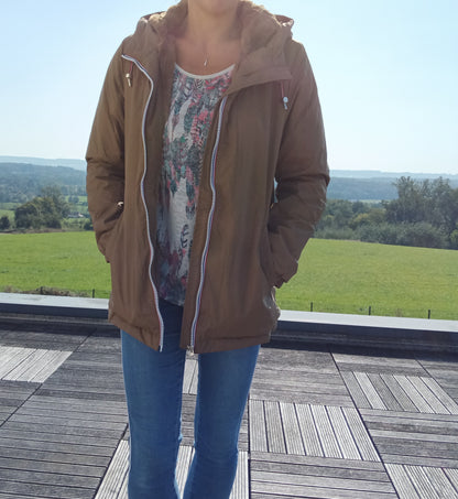 Woman wearing brown Laura Jo raincoat and jeans outdoors, Le Petit Placard fashion