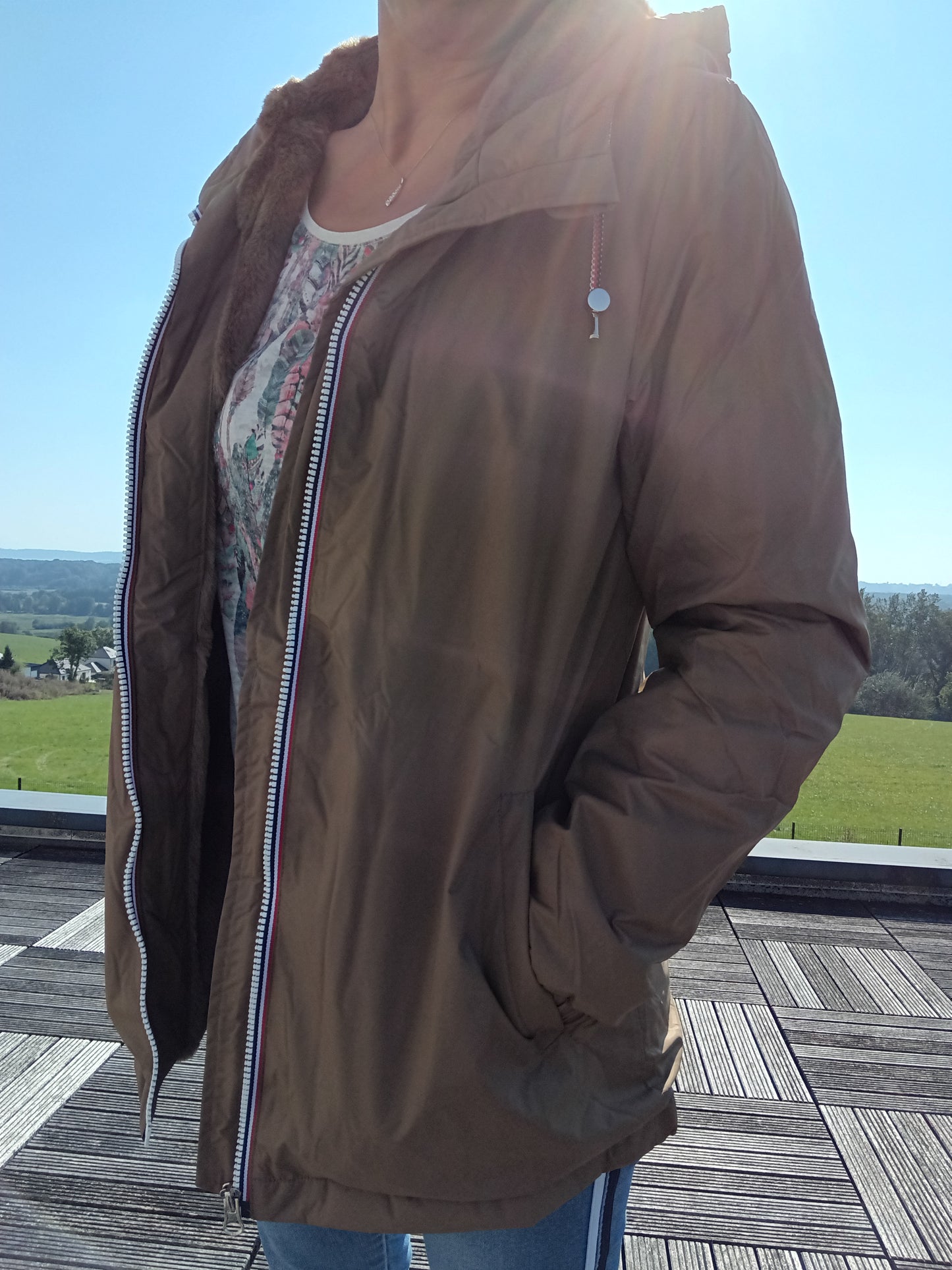 Woman wearing a brown Laura Jo rain jacket outdoors, Le Petit Placard fashion