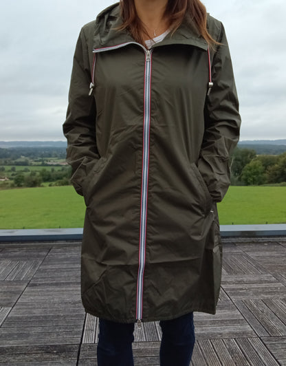 Kaki Laura Jo long waterproof parka with hood, worn outdoors on a terrace, Le Petit Placard