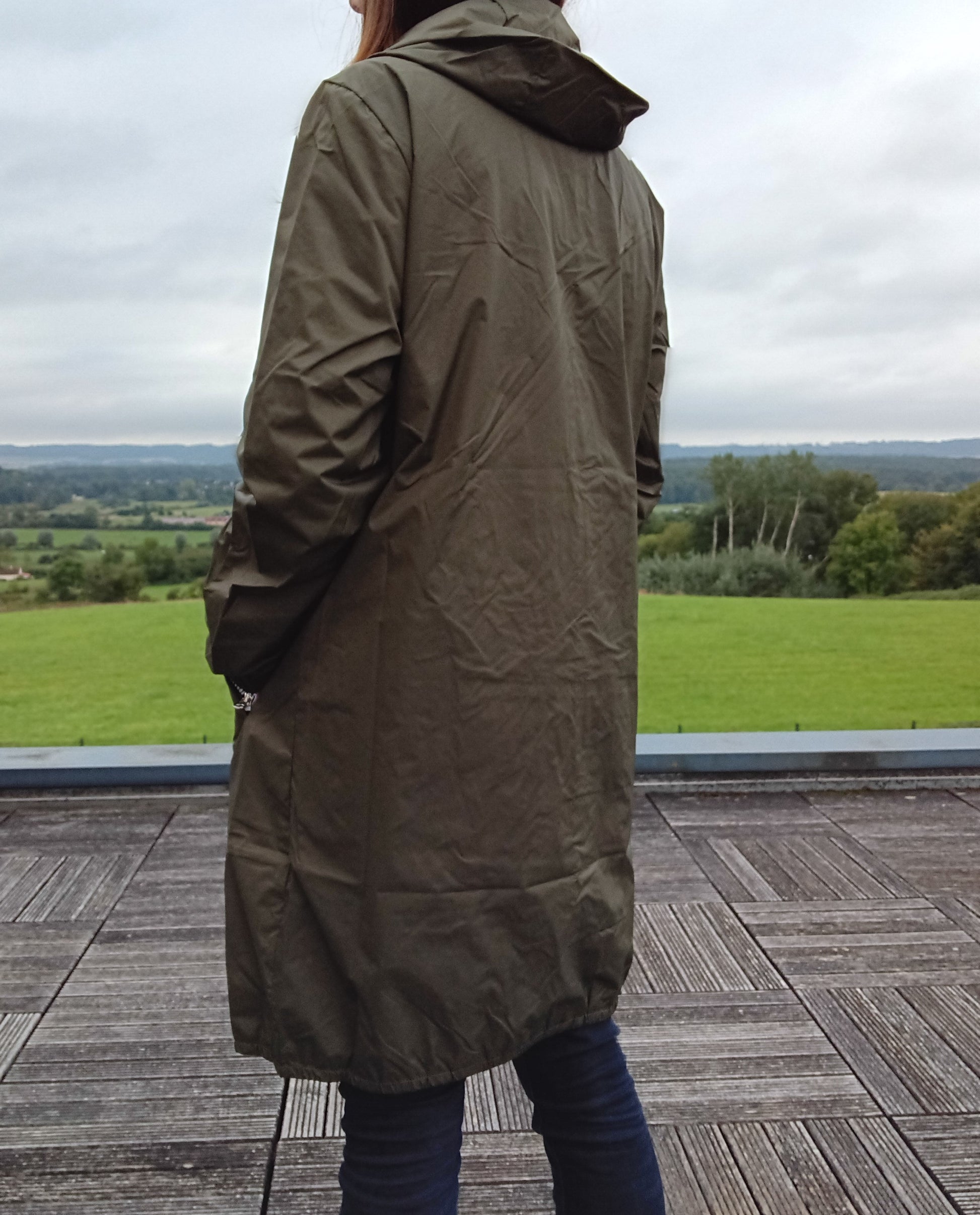 Woman in khaki Laura Jo raincoat standing outdoors, Le Petit Placard fashion