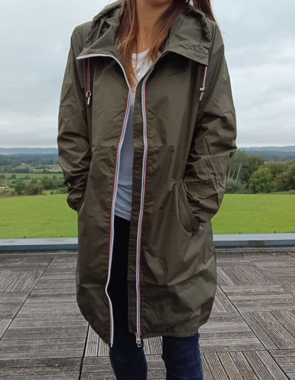 Woman wearing khaki Laura Jo raincoat outdoors, Le Petit Placard fashion collection