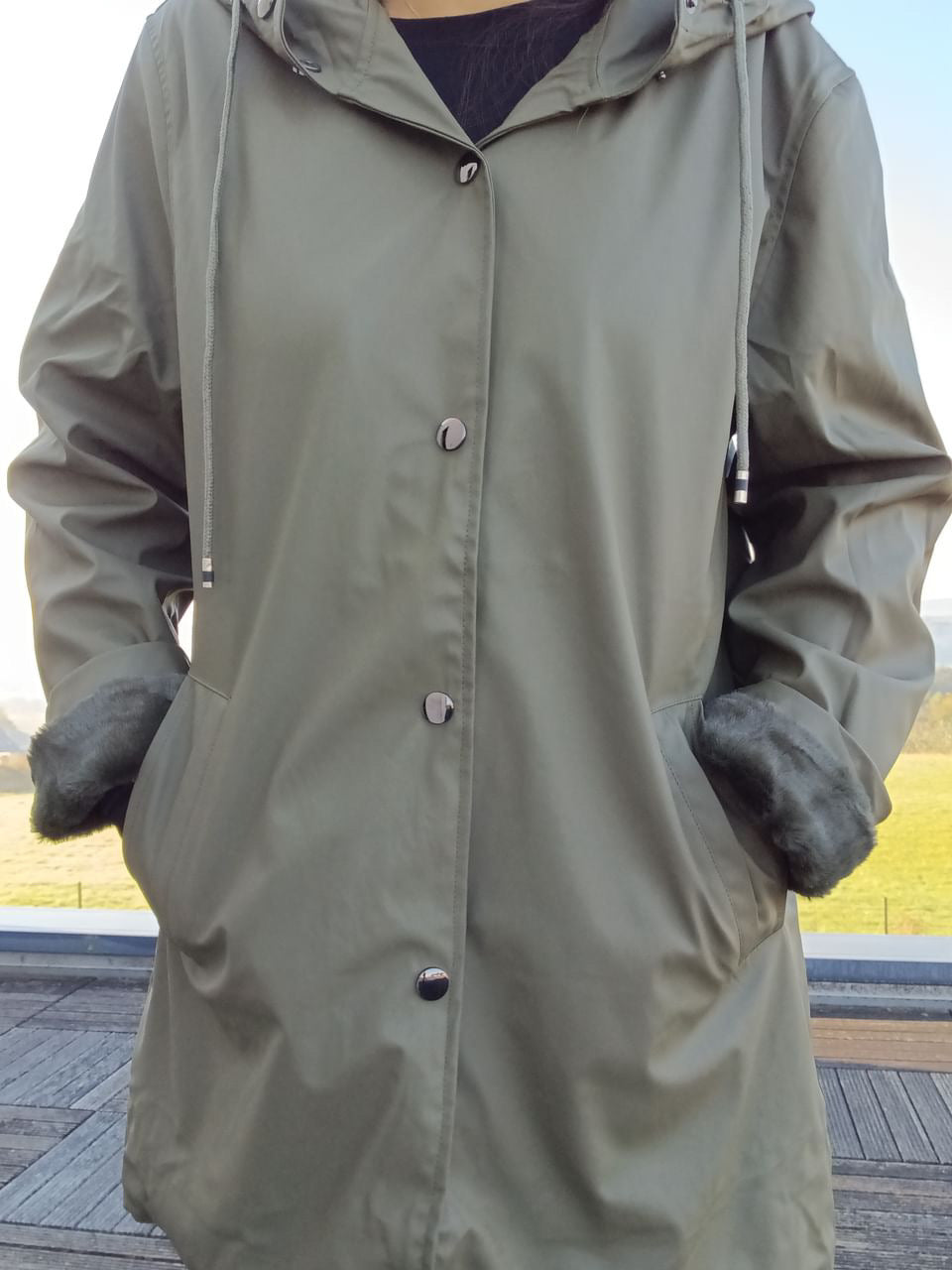 Long khaki waterproof hooded coat with faux fur lining, Le Petit Placard outdoor fashion