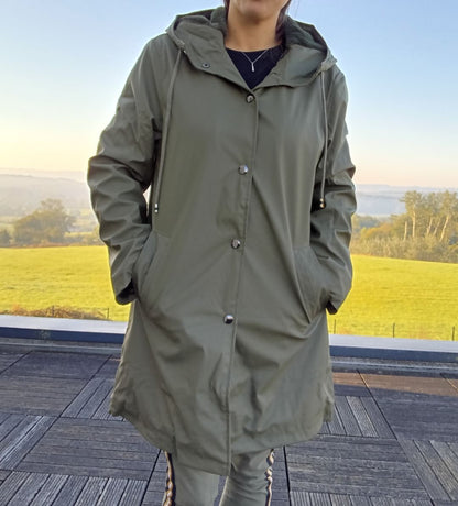 Woman wearing a khaki Laura Jo raincoat outdoors, Le Petit Placard trendy outerwear
