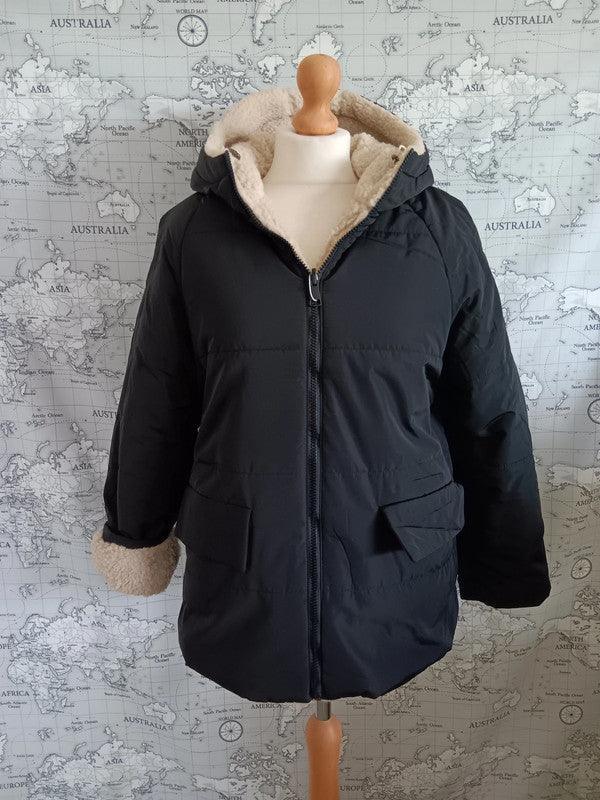 Reversible black and beige faux shearling waterproof jacket on mannequin, Le Petit Placard