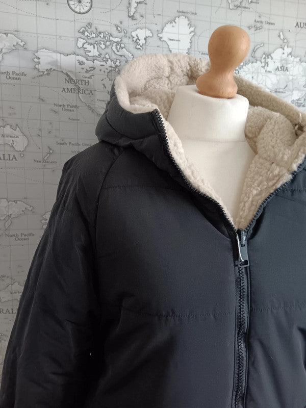 Reversible black and beige faux shearling waterproof short coat on mannequin, Le Petit Placard