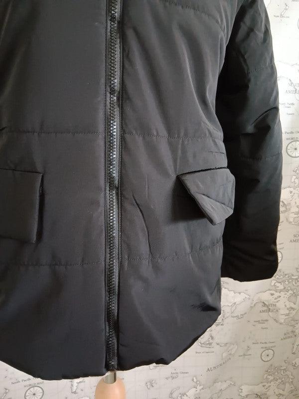 Black reversible waterproof short coat with front zipper and flap pockets by Le Petit Placard