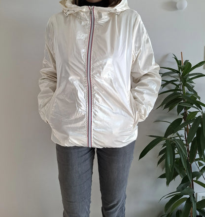 Woman wearing shiny white Laura Jo raincoat with striped zipper, Le Petit Placard fashion