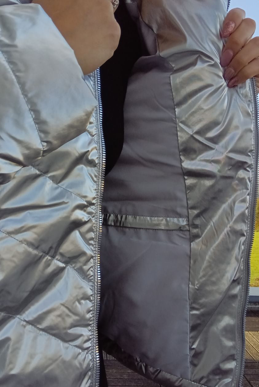 Close-up of a silver Laura Jo quilted rain jacket with inside pocket, Le Petit Placard