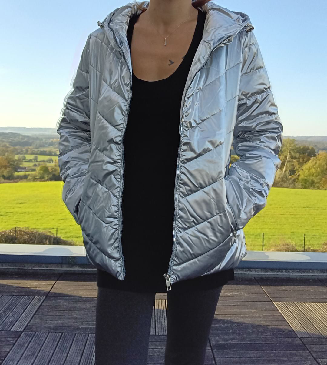 Woman wearing a shiny silver Laura Jo rain jacket outdoors, Le Petit Placard fashion