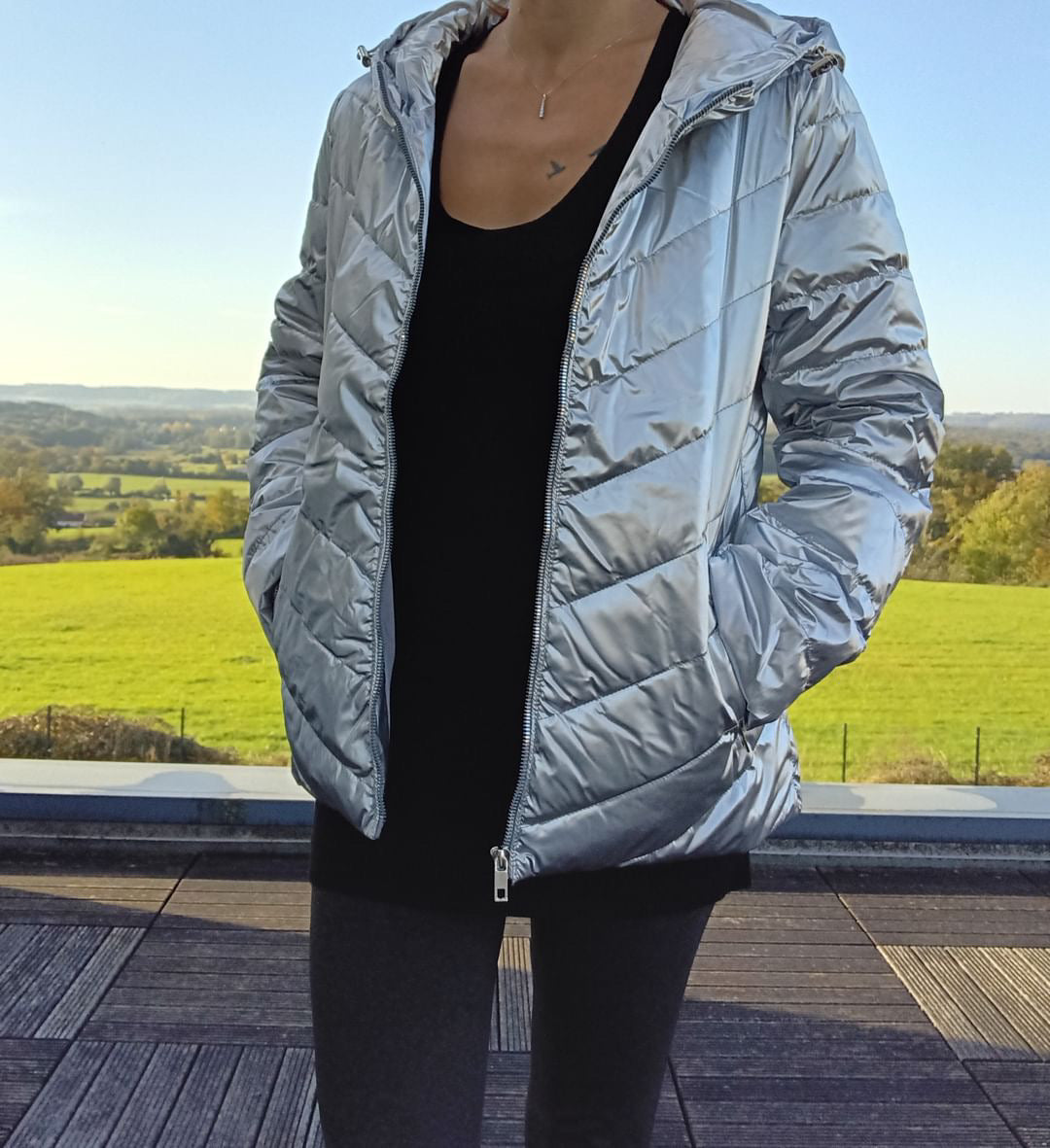 Woman wearing silver Laura Jo puffer jacket outdoors, Le Petit Placard fashion